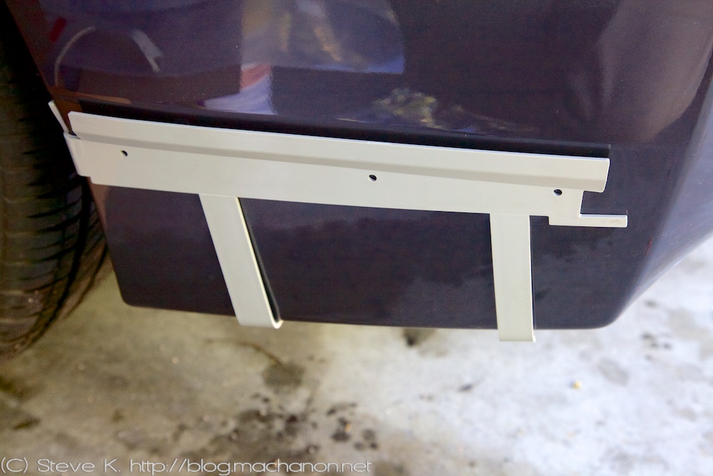 Outer LH installation bracket adhered to rear bumper