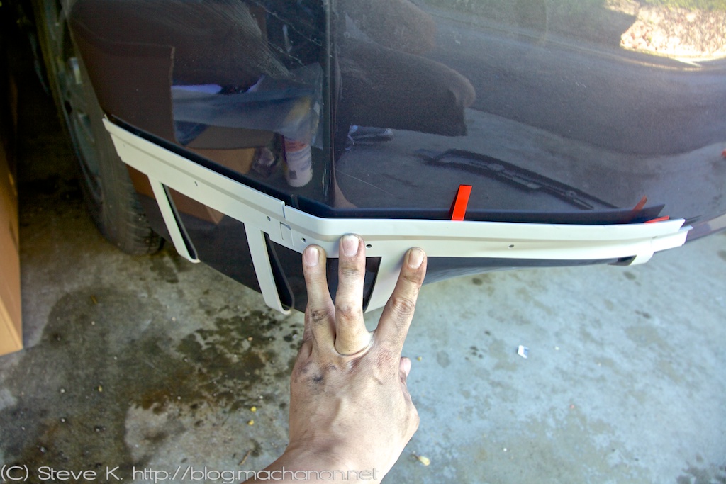 Align inner LH installation bracket onto lower left side of rear bumper