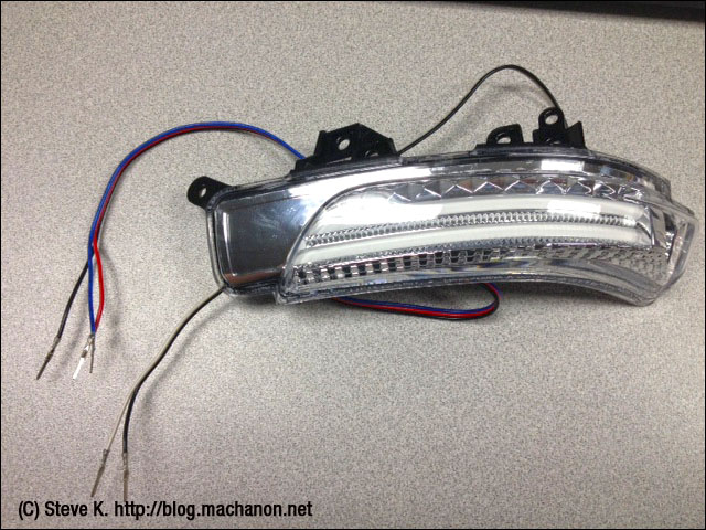 Aftermarket JDM-style 3-in-1 combo side mirror welcome winker LEDs.