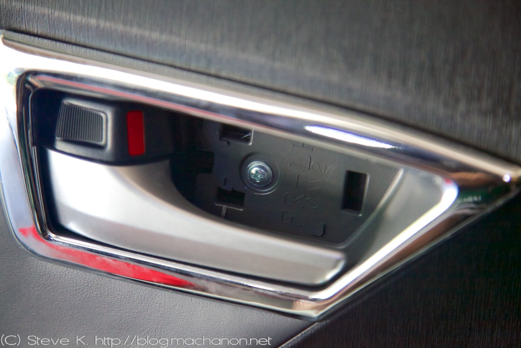 3rd gen Prius door panel removal: inner door handle cap removed.
