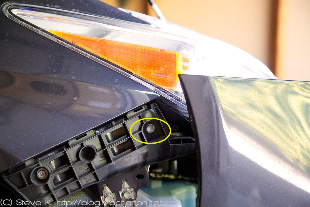 Removing the side bolt holding the headlight onto the fender, 2010-2014 Prius