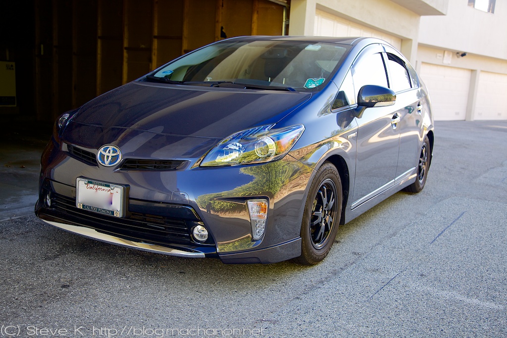 Quarter-side view of 2012 Toyota Prius ZVW30 with custom blacked-out headlights