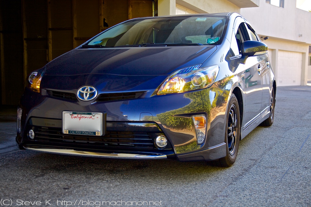 Quarter-side view of 2012 Toyota Prius ZVW30 with custom blacked-out headlights and custom DRL mod on